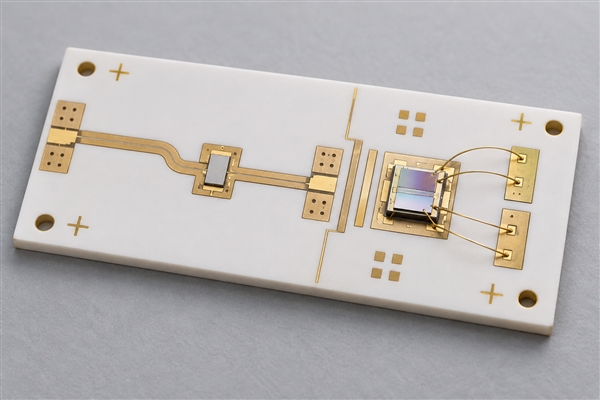 Conceptual thin film alumina RF and photonics circuit with bare die and wire bonds